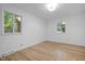 Spacious bedroom with hardwood floors and two windows, offering a bright, inviting atmosphere at 2224 Clements Dr, Durham, NC 27704
