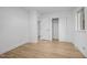 Bright bedroom with wood-look floors, closet, neutral walls, and natural light at 2224 Clements Dr, Durham, NC 27704