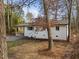 Charming one-story home featuring a white brick exterior, a well-maintained yard, and a cozy, covered carport at 2224 Clements Dr, Durham, NC 27704