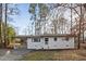 A charming one-story brick home with a screened-in carport and lovely curb appeal at 2224 Clements Dr, Durham, NC 27704