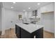 A modern kitchen with stainless steel appliances, shaker cabinets, and an island at 2224 Clements Dr, Durham, NC 27704