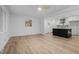 Open-concept living room boasts hardwood floors, natural light, and a modern kitchen island at 2224 Clements Dr, Durham, NC 27704