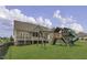 Large backyard with a play set, swing set, and lots of grass, ideal for outdoor activities at 25 Westbourne Ln, Youngsville, NC 27596