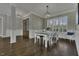 Bright dining room featuring an elegant chandelier, wallpaper and wainscoting at 25 Westbourne Ln, Youngsville, NC 27596
