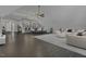 Spacious living room featuring stylish furniture, dark wood floors, and an open floor plan at 25 Westbourne Ln, Youngsville, NC 27596