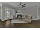 Cozy living room with a fireplace, hardwood floors and great natural light at 25 Westbourne Ln, Youngsville, NC 27596