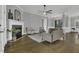 Elegant living room boasts hardwood floors, fireplace, and comfortable seating, creating an inviting space at 25 Westbourne Ln, Youngsville, NC 27596