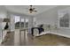 Spacious main bedroom with hardwood floors and balcony access providing light and scenic views at 25 Westbourne Ln, Youngsville, NC 27596
