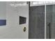 Contemporary shower with a herringbone pattern on the shower walls and a rainfall shower head at 25 Westbourne Ln, Youngsville, NC 27596