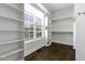 Spacious walk-in closet with custom shelving and a large window at 25 Westbourne Ln, Youngsville, NC 27596
