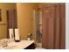 Bathroom features a vanity, toilet and shower with curtain at 259 Brassfield Dr, Burlington, NC 27217