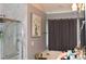 Bathroom boasts a marble shower and vanity with a long mirror at 259 Brassfield Dr, Burlington, NC 27217