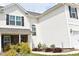 View of the side of the house with manicured shrubs and a manicured green lawn at 259 Brassfield Dr, Burlington, NC 27217