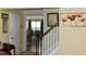 Hallway area showcasing a staircase, neutral walls, and doorway leading to the dining room at 259 Brassfield Dr, Burlington, NC 27217