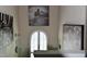 Decorated hallway featuring a white arched window and modern wall art at 259 Brassfield Dr, Burlington, NC 27217