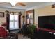 Inviting living room area featuring comfortable seating, large windows, and a ceiling fan at 259 Brassfield Dr, Burlington, NC 27217