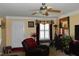 View of front door and living room with window, ceiling fan, and neutral decor at 259 Brassfield Dr, Burlington, NC 27217
