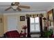 Inviting room with natural light, ceiling fan, seating, and a view of the outdoors at 259 Brassfield Dr, Burlington, NC 27217
