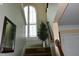 Staircase with a window, interior decorations, and view to a white door at 259 Brassfield Dr, Burlington, NC 27217