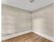 Cozy bedroom featuring neutral walls, clean trim, and durable laminate flooring at 2677 Nc-39, Henderson, NC 27537