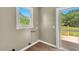 Laundry room with a window, utility hookups, and access to the back deck at 2677 Nc-39, Henderson, NC 27537