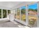 Sunroom with multiple windows overlooking the backyard and access to the exterior at 2677 Nc-39, Henderson, NC 27537