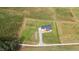 Expansive aerial view of a modern farmhouse with a long driveway and fenced yard at 2775 Eagles Roost Trl, Burlington, NC 27217