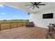 Relaxing back deck with a ceiling fan and outdoor seating and beautiful views at 2775 Eagles Roost Trl, Burlington, NC 27217