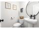 This bathroom features white walls, a modern toilet, a stylish sink and fixtures at 2775 Eagles Roost Trl, Burlington, NC 27217