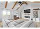 Cozy living room featuring a fireplace, TV, vaulted ceilings, and comfortable seating at 2775 Eagles Roost Trl, Burlington, NC 27217