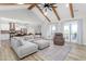 Spacious living room with vaulted ceilings, exposed beams, and modern furnishings at 2775 Eagles Roost Trl, Burlington, NC 27217