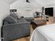 Cozy interior features a sitting area, television, and desk with wood flooring at 2775 Eagles Roost Trl, Burlington, NC 27217