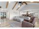 Open-concept living room features hardwood floors, a comfortable sofa, and easy access to the kitchen at 2775 Eagles Roost Trl, Burlington, NC 27217