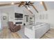 Spacious living room features a fireplace, vaulted ceilings, and comfortable seating at 2775 Eagles Roost Trl, Burlington, NC 27217