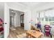 Bright playroom features light wood floors, a small table, and an adorable hammock full of stuffed animals at 2775 Eagles Roost Trl, Burlington, NC 27217