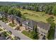 Aerial view of homes and golf course in a suburban neighborhood at 2820 Charleston Oaks Dr, Raleigh, NC 27614