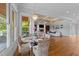 Charming breakfast area with views of the backyard, a chandelier, and wicker chairs at 2820 Charleston Oaks Dr, Raleigh, NC 27614