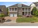 Charming two-story brick house with balconies, a brick driveway, and manicured lawn at 2820 Charleston Oaks Dr, Raleigh, NC 27614