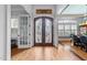 Elegant foyer boasting hardwood floors and a beautiful stained glass double front door at 2820 Charleston Oaks Dr, Raleigh, NC 27614