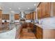 Spacious kitchen features wooden cabinets, stainless steel appliances and granite countertops at 2820 Charleston Oaks Dr, Raleigh, NC 27614