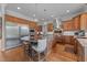 Gourmet kitchen features a granite island, stainless steel appliances, and wood cabinets at 2820 Charleston Oaks Dr, Raleigh, NC 27614