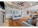 Inviting living room featuring a fireplace, coffered ceiling, and hardwood floors at 2820 Charleston Oaks Dr, Raleigh, NC 27614