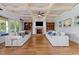 Cozy living room with coffered ceilings, fireplace, and built-in shelving at 2820 Charleston Oaks Dr, Raleigh, NC 27614