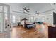 Spacious main bedroom features hardwood floors, ceiling fans, and lots of natural light at 2820 Charleston Oaks Dr, Raleigh, NC 27614