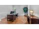 Bright office space with hardwood floors, shutters, and a wooden desk at 2820 Charleston Oaks Dr, Raleigh, NC 27614