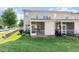 Backyard view of townhomes with well-maintained lawn and screened porches at 300 Sugar Maple Ave, Wake Forest, NC 27587