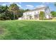 Wide backyard view showcasing the lawn and the back of residential homes at 300 Sugar Maple Ave, Wake Forest, NC 27587