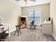 Bedroom with carpet and neutral walls. It includes a desk, bookshelf, and stool, ideal for a workspace at 300 Sugar Maple Ave, Wake Forest, NC 27587