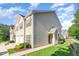 Corner unit townhome with well-manicured lawn and mature landscaping, offering great curb appeal at 300 Sugar Maple Ave, Wake Forest, NC 27587