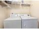Functional laundry room with a washer, dryer, and shelving for storage at 300 Sugar Maple Ave, Wake Forest, NC 27587